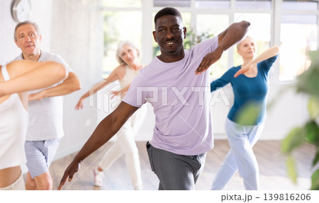 Mature men and women practicing Hip-hop dance in training hall 139816206