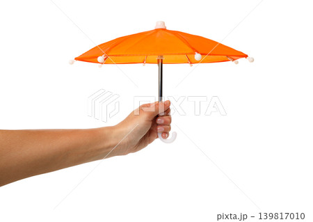 Hand holding orange umbrella symbolizes insurance, isolated, PNG Hand holding orange umbrella symbolizes insurance, isolated, PNG 139817010