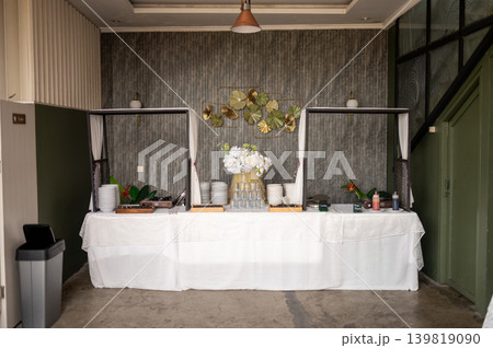 Decorative wedding buffet table with food and drink display arrangement 139819090