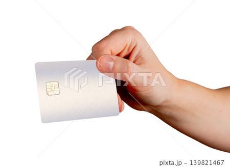 Hand gripping bank card between fingers. Payment card shown in firm gesture. Financial banking concept for purchase payment and money access.. 139821467