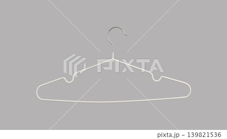 Thin clothing hanger with non slip coating on neutral background. Lightweight wardrobe accessory with metal hook. Storage tool designed for careful garment hanging.. 139821536
