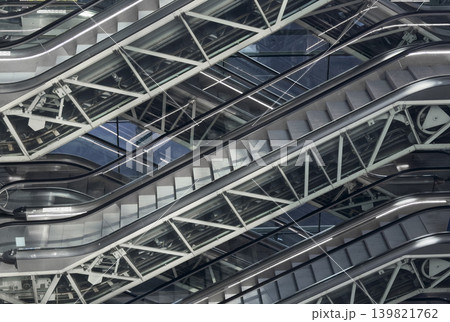 Empty escalator inside modern subway interior with geometric perspective. metal staircase showing 139821762