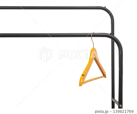 Wood hanger, hook hanging on metal rod, clothing rail isolated on white background. Wood hanger, hook hanging on metal rod, clothing rail isolated on white background. 139821769