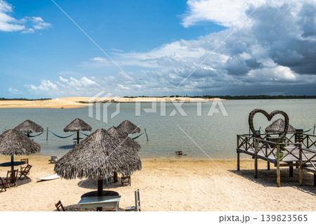 Straw huts on the banks of the Torta Lagoon, Tatajuba Beach at Jijoca de Jericoacoara, Ceara in Brazil 139823565
