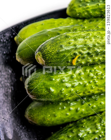 Fresh Green Cucumbers On Black Plate Fresh Green Cucumbers On Black Plate 139823613