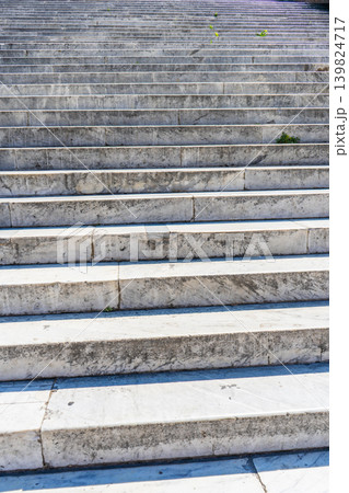 Rome Italy Ancient marble staircase with weathered stone steps leading upwards to success. Architecture background Rome Italy Ancient marble staircase with weathered stone steps leading upwards to success. Architecture background 139824717