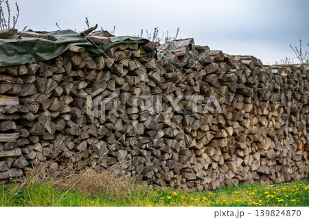 Harvested firewood for the stove and fireplace, stacked on top of each other 139824870