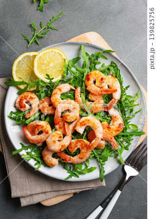 Salad with grilled shrimps prawns and arugula greens 139825756