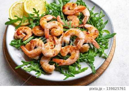 Grilled shrimps prawns and arugula salad, healthy eating Grilled shrimps prawns and arugula salad, healthy eating 139825761