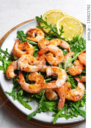 Grilled shrimps prawns and arugula salad, healthy eating 139825762