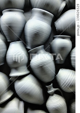 Clay pots and vases are packed together closely Clay pots and vases are packed together closely 139826329