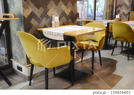 Interior view showing set tables and elegant chairs in a restaurant or cafe 139826601