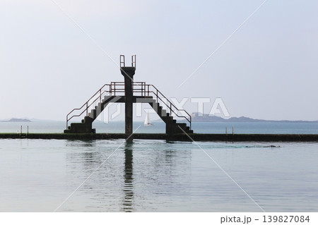 The seawater swimming-pool with a diving board in Saint-Malo, France The seawater swimming-pool with a diving board in Saint-Malo, France 139827084