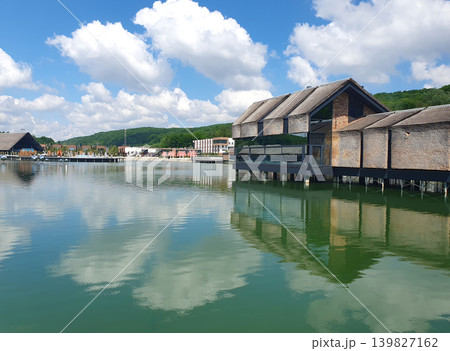 Modern Lakeside Resort Buildings Reflected on Calm Water 139827162
