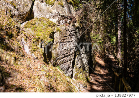 Sandstone rock formations near a trail in Gauja National Park in Latvia Sandstone rock formations near a trail in Gauja National Park in Latvia 139827977