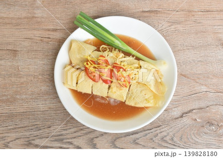 fresh Chinese spring roll made from egg omelet wrapped tofu and pork with bean sprout dressing sweet red gravy sauce couple mustard on plate fresh Chinese spring roll made from egg omelet wrapped tofu and pork with bean sprout dressing sweet red gravy sauce couple mustard on plate 139828180
