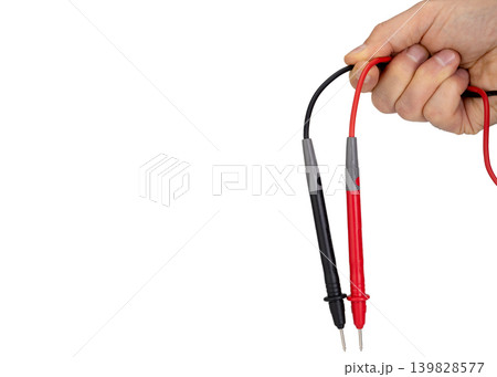 Hand Holding Multimeter Probes Isolated On White Hand Holding Multimeter Probes Isolated On White 139828577