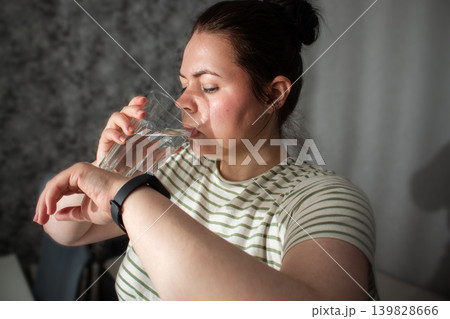 Woman watching on health tracking app. Reading health summary without anxiety. Shift from compulsive hyper focus on checking data to calm living. Modern technologies as assistant not stress Woman watching on health tracking app. Reading health summary without anxiety. Shift from compulsive hyper focus on checking data to calm living. Modern technologies as assistant not stress 139828666