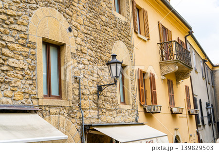 Windows and Lantern. Republic San Marino old house architecture. Building facade wall street city. Windows and Lantern. Republic San Marino old house architecture. Building facade wall street city. 139829503