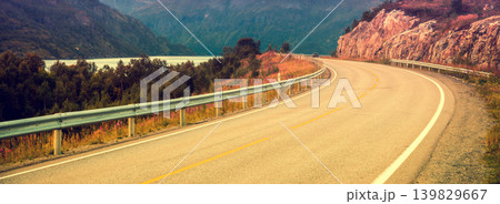 Driving a car on mountain road. Nature Norway. Polar circle. Lofoten islands Driving a car on mountain road. Nature Norway. Polar circle. Lofoten islands 139829667