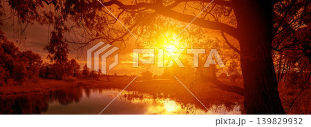 Rural landscape with lake at magical orange sunset Rural landscape with lake at magical orange sunset 139829932