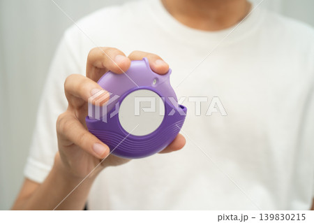Asthma and chronic obstructive pulmonary disease COPD, Asian teenage using metered dose inhaler MDI. Asthma and chronic obstructive pulmonary disease COPD, Asian teenage using metered dose inhaler MDI. 139830215