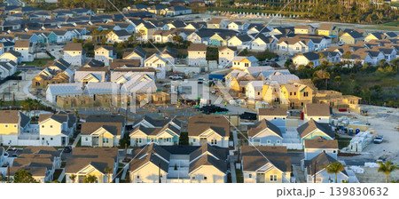 Construction in new developing suburban area. Development of residential housing in American suburbs. Real estate market in the USA Construction in new developing suburban area. Development of residential housing in American suburbs. Real estate market in the USA 139830632