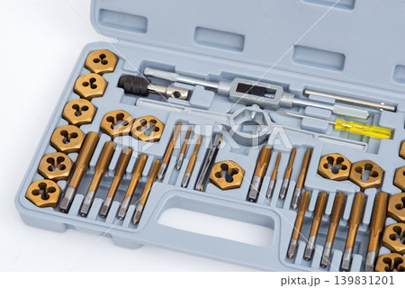 Professional tap and die set with titanium-coated thread cutting tools organized in a gray plastic case. 139831201