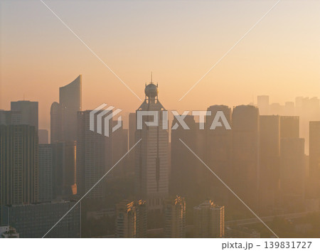 Sunrise over Hangzhou cityscape from above featuring skyscrapers and early morning light Sunrise over Hangzhou cityscape from above featuring skyscrapers and early morning light 139831727