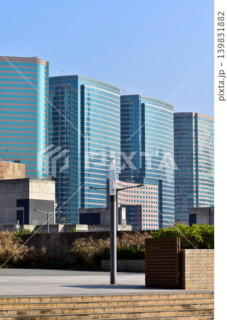 Low angle view of skyscapers of Hong Kong. Hong Kong cityscape. Modern Buildings. Building exterior. Travel concept. Low angle view of skyscapers of Hong Kong. Hong Kong cityscape. Modern Buildings. Building exterior. Travel concept. 139831882