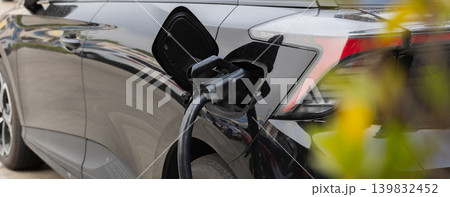 Electric car charging station. Hybrid car Electric charger station in the Car Park. Electric car charging station. Hybrid car Electric charger station in the Car Park. 139832452