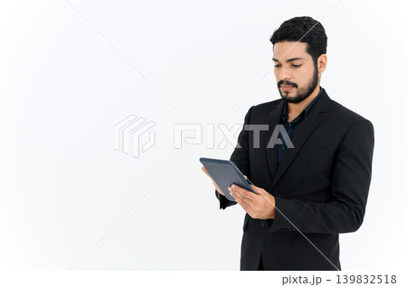 portrait of cheerful attractive young businessman standing and using digital tablet isolated over white background. portrait of cheerful attractive young businessman standing and using digital tablet isolated over white background. 139832518