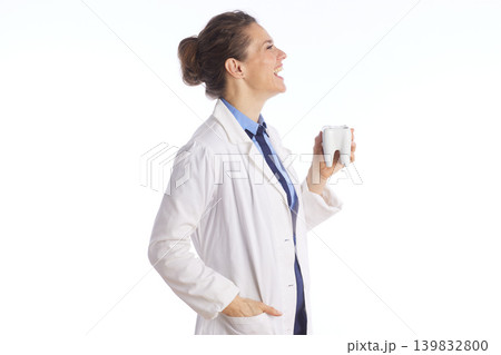 Visionary Dentist Looking Up While Holding Tooth Model Visionary Dentist Looking Up While Holding Tooth Model 139832800