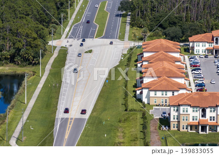 Apartment-style condominiums in Florida suburbs, surrounded by greenery and designed for modern suburban living in the USA 139833055
