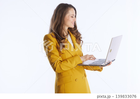 Engaged Executive Typing on Silver Laptop 139833076