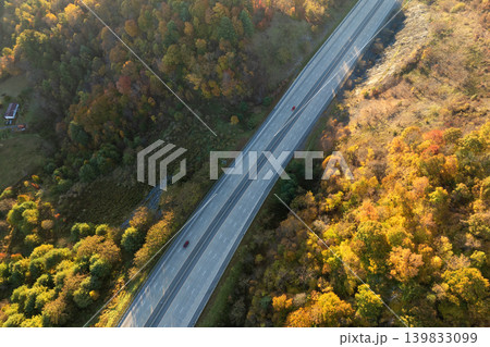 American highway with fast moving traffic. Interstate transportation concept American highway with fast moving traffic. Interstate transportation concept 139833099