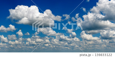 Blue sky with white summer rain clouds. Colorful summer landscape Blue sky with white summer rain clouds. Colorful summer landscape 139833122