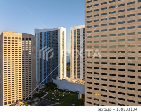 Miami downtown office district in Florida, USA at sunset. High commercial and residential skyscraper buildings in modern American city Miami downtown office district in Florida, USA at sunset. High commercial and residential skyscraper buildings in modern American city 139833134