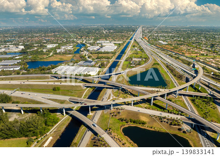 USA car urban transportation infrastructure. American highway junction with fast driving vehicles in Miami, Florida USA car urban transportation infrastructure. American highway junction with fast driving vehicles in Miami, Florida 139833141