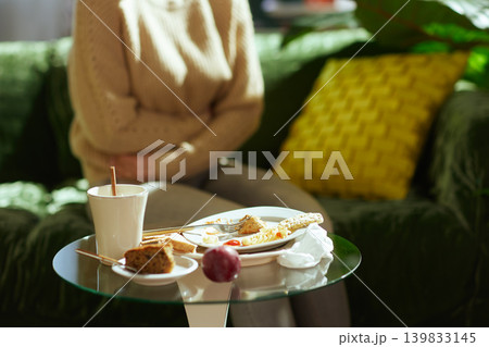 Woman with Stomach Pain After Unhealthy Meal 139833145
