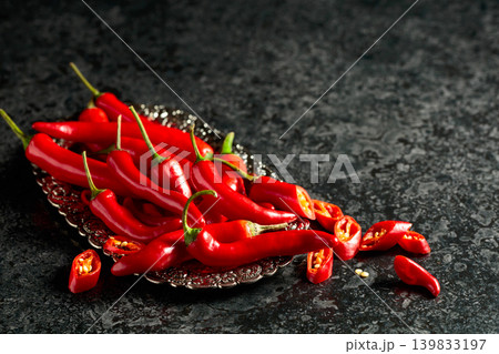 Red hot chili peppers on a silver tray. Red hot chili peppers on a silver tray. 139833197