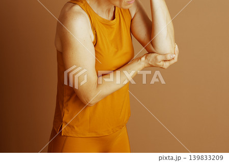 Woman Cradling Her Painful Elbow 139833209