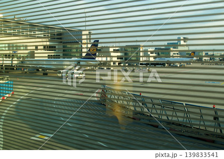 Frankfurt, Germany, 02 September 2017: View over the apron with aircraft from a frequent flyer lounge Frankfurt, Germany, 02 September 2017: View over the apron with aircraft from a frequent flyer lounge 139833541
