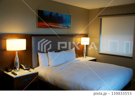 Chicago, United States, May 11 2018: King size bed in luxury hotel on Michigan Avenue Chicago, United States, May 11 2018: King size bed in luxury hotel on Michigan Avenue 139833553