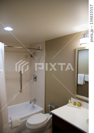 Chicago, United States, May 11 2018: Small bathroom with bathtub and shower curtain on Michigan Avenue Chicago, United States, May 11 2018: Small bathroom with bathtub and shower curtain on Michigan Avenue 139833557