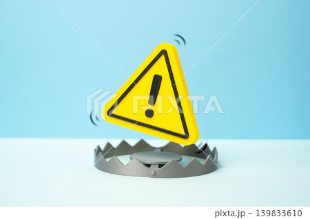 Warning sign above the trap. Awareness of dangers and pitfalls in business and life. Risk management, crisis prevention and caution during decision making. Warning sign above the trap. Awareness of dangers and pitfalls in business and life. Risk management, crisis prevention and caution during decision making. 139833610
