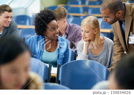 University student, teacher and classroom or test help in lecture hall or education, scholarship or learning. Female people, friends and professor or paperwork at college academy, teaching or London University student, teacher and classroom or test help in lecture hall or education, scholarship or learning. Female people, friends and professor or paperwork at college academy, teaching or London 139834028