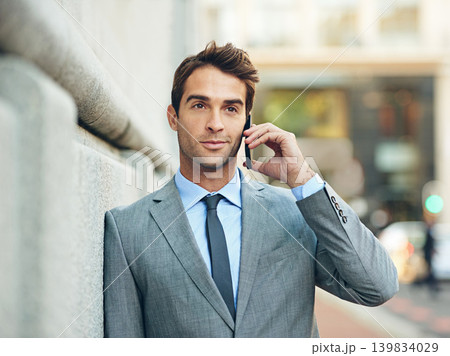 Business, man and outdoor thinking with phone call to client with legal ideas in consultation. Attorney, planning or lawyer in conversation on smartphone at court or law firm with virtual contact Business, man and outdoor thinking with phone call to client with legal ideas in consultation. Attorney, planning or lawyer in conversation on smartphone at court or law firm with virtual contact 139834029