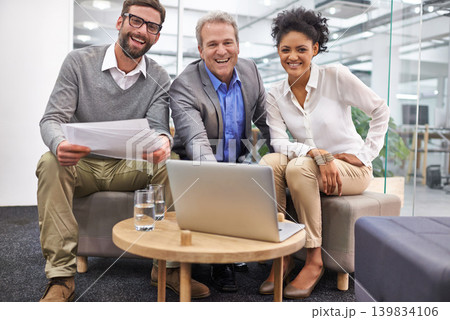 Businesspeople, portrait and laptop as teamwork or paperwork in office, creative agency or project planning. Men, woman and smile or collaboration as campaign meeting for proposal, document or online Businesspeople, portrait and laptop as teamwork or paperwork in office, creative agency or project planning. Men, woman and smile or collaboration as campaign meeting for proposal, document or online 139834106
