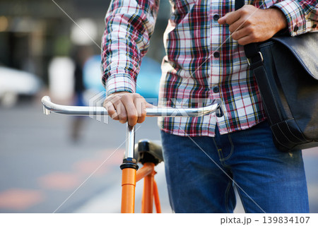 Hands, person and push bike in street to travel on eco friendly transport outdoor, commute or walking on trip. Cycling, bag and bicycle in urban town, city or road for journey or closeup in summer 139834107